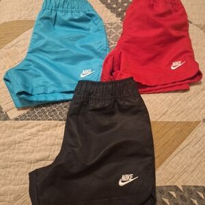 Nike kids shorts in black, red, and teal - 3-pack look